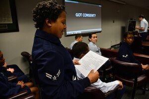 U.S. Air Force Airman 1st Class Chae Reid, 497th Operations Support Squadron intelligence analyst, participates in an icebreaker exercise before a “Got Consent?” mock trial at Langley Air Force Base, Va., March 21, 2014. Before the trial began the group of first-term Airmen participated in an icebreaker session to create a relaxed venue. Reid is a native of Vineland, N.J. (U.S. Air Force photo by Senior Airman Aubrey White/Released)