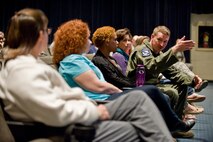 Col. Lamar Pettus, 4th Fighter Wing vice commander, speaks to spouses during a town hall meeting, March 12, 2014, at the base theater at Seymour Johnson Air Force Base, N.C.  Members of 4th FW leadership and the 4th Force Support Squadron spoke with Airmen and their spouses about upcoming force management programs.  (U.S. Air Force photo/Airman 1st Class Brittain Crolley)