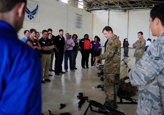 U.S. Air Force Staff Sgt. Travis Wilbanks, 38th Rescue Squadron pararescueman, shows the equipment that 38th RQS pararescuemen use while deployed to members of Leadership Georgia at Moody Air Force Base, Ga., March 21, 2014. During their visit, members toured the base and attended a static display to get a complete understanding of Moody’s mission capabilities. (U.S. Air Force photo by Senior Airman Olivia Bumpers/Released)