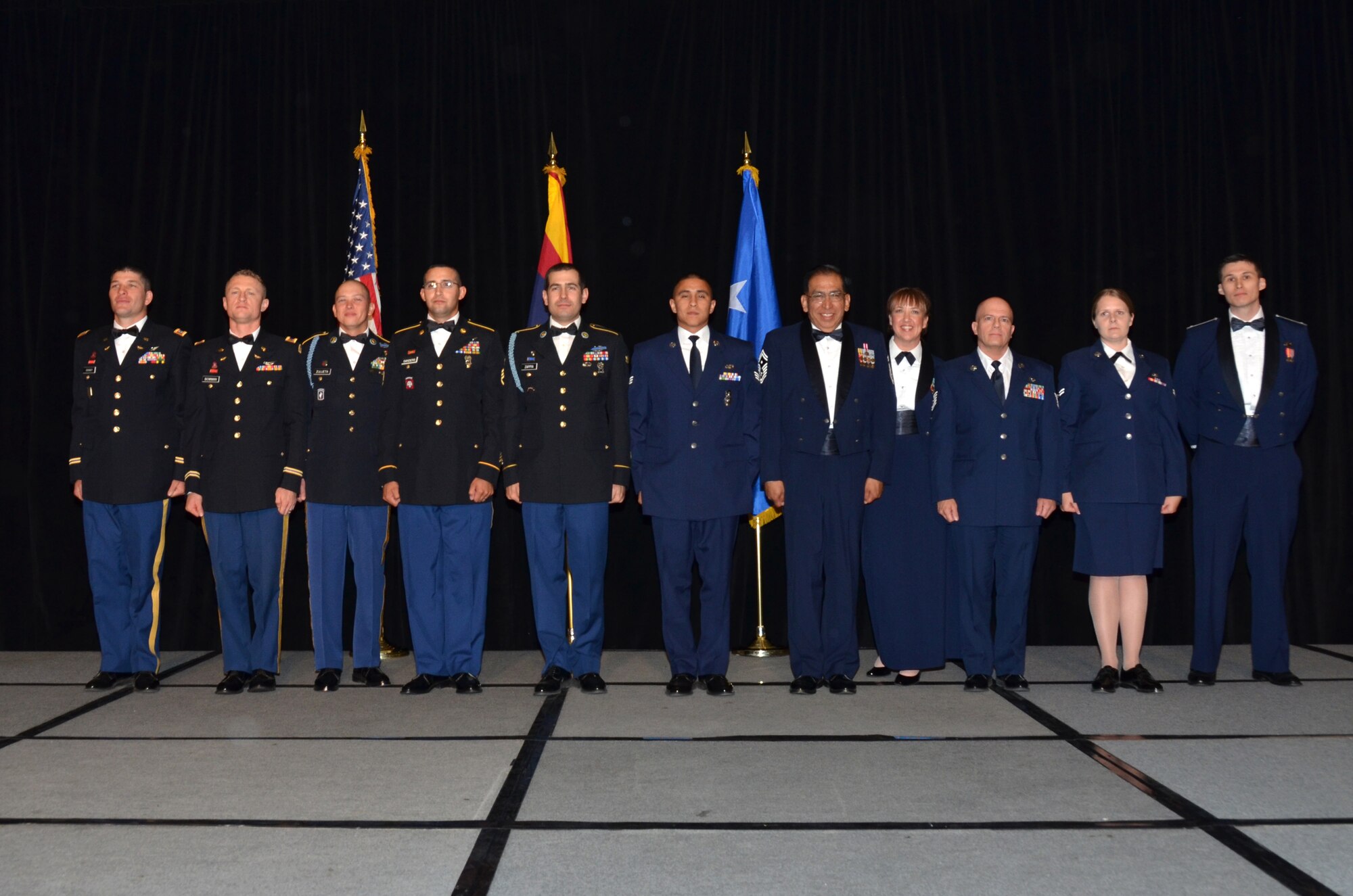 The 2013 Outstanding Soldier and Airmen of the Year award recipients are, from left to right: Capt. Caleb Grandy, 98th ATC, Oscar F. Temple Officer of the Year, CW2 Samuel Bowman, 98th ATC, Carl G. Hoyer Warrant Officer of the Year, 1st Sgt. Justin Zulueta, 158 MEB, First Sergeant of the Year, Staff Sgt. David Sanders, WAATS, Noncommissioned Officer of the Year, Spc. Gino Zappia, 158th MEB, Soldier of the Year, Senior Airman Orlando Calzadillas, 161 ARW, Command Chief Master Sergeant Award recipient, Senior Master Sgt. Raul Ortega, 214th RG, First Sergeant of the Year, Master Sgt. Kristeen Jones, 162nd  FW, Senior Noncommissioned Officer of the Year, Technical Sgt. Christopher Davis, 214th RG, Noncommissioned Officer of the Year, Airman 1st Class Laura Carroll, 161st ARW, Airman of the Year and 1st Lt. Mark Gronau, 214th RG, Major General Donald L. Owens Junior Officer of the Year. (U. S. Air National Guard Photo by Senior Airman Rashaunda Williams/Released)