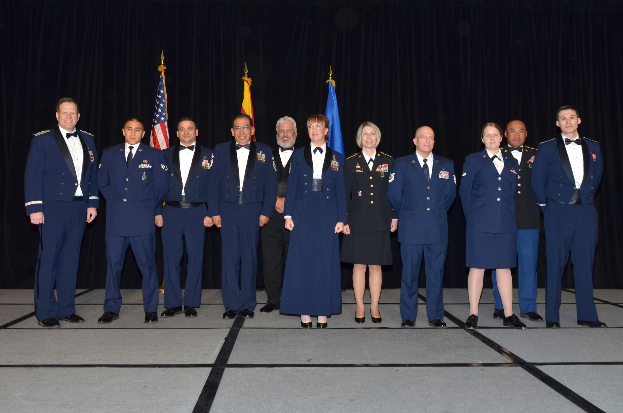 The 2013 Outstanding Airmen of the Year award recipients are, from left to right: Maj. Gen. Michael T. McGuire, the Adjutant General Arizona National Guard, Senior Airman Orlando Calzadillas, 161 ARW, Command Chief Master Sergeant Award recipient, Chief Master Sgt. Daniel Gutierrez, Arizona State Command Chief Master Sergeant, Senior Master Sgt. Raul Ortega, 214th RG, First Sergeant of the Year, Mr. Glenn Klassen, Phoenix Air National Guard Patriots, Master Sgt. Kristeen Jones, 162nd  FW, Senior Noncommissioned Officer of the Year, Command Sergeant Major Pamela Higgins, Command Sergeant Major of the Arizona Army National Guard, Technical Sgt. Christopher Davis, 214th RG, Noncommissioned Officer of the Year, Airman 1st Class Laura Carroll, 161st ARW, Airman of the Year, Master Sgt. Ben Acosta, President of EANGA, and 1st Lt. Mark Gronau, 214th RG, Major General Donald L. Owens Junior Officer of the Year. (U. S. Air National Guard Photo by Senior Airman Rashaunda Williams/Released)