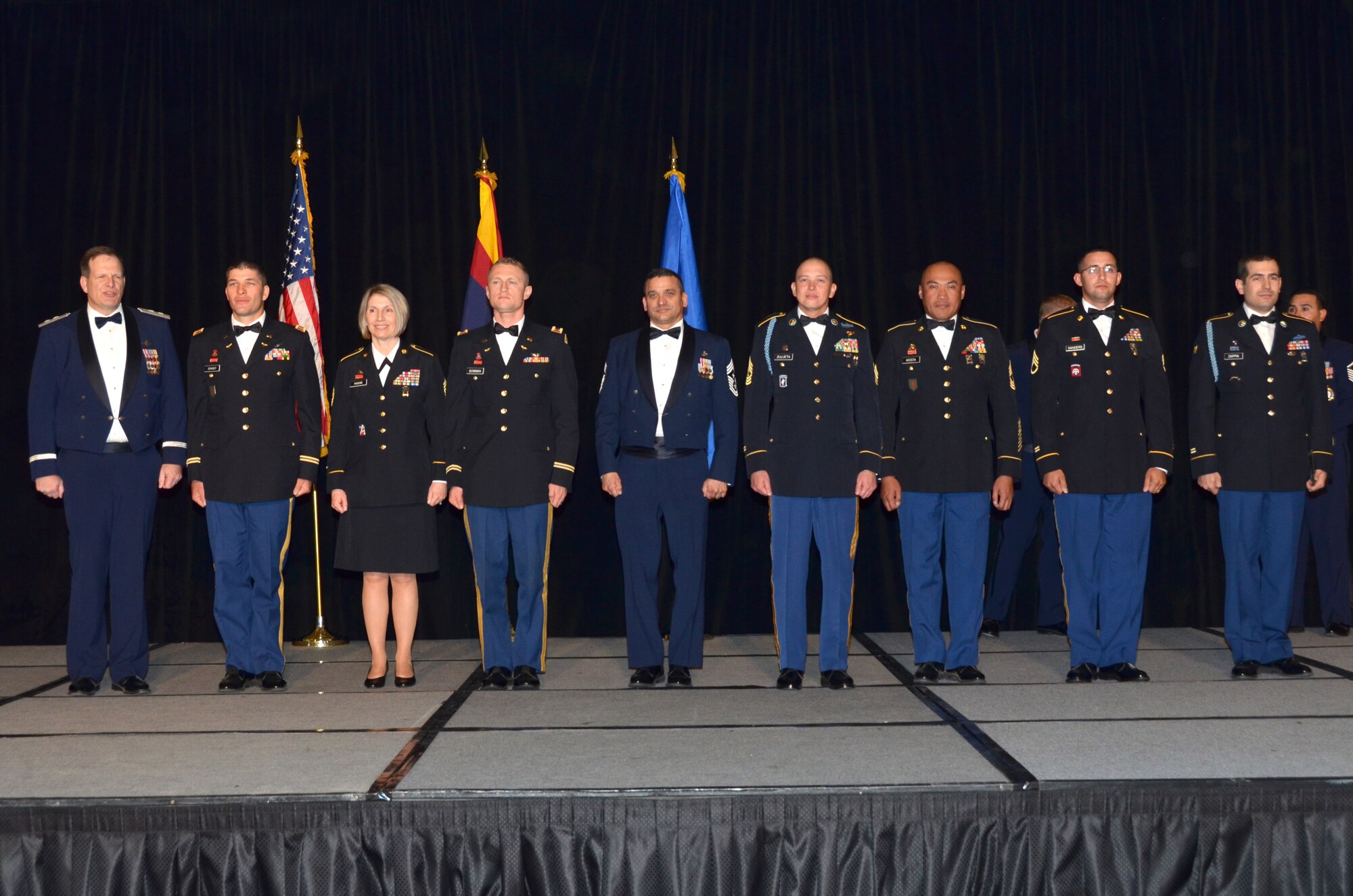 The 2013 Outstanding Soldier of the Year award recipients are, from left to right: Maj. Gen. Michael T. McGuire, the Adjutant General Arizona National Guard,  Capt. Caleb Grandy, 98th ATC, Oscar F. Temple Officer of the Year, Command Sgt. Maj. Pamela Higgins, Command Sergeant Major of the Arizona Army National Guard, CW2 Samuel Bowman, 98th ATC, Carl G. Hoyer Warrant Officer of the Year, Chief Master Sgt. Daniel Gutierrez, Arizona State Command Chief Master Sergeant, 1st Sgt. Justin Zulueta, 158 MEB, First Sergeant of the Year, Master Sgt. Ben Acosta, President of EANGA,  Staff Sgt. David Sanders, WAATS, Noncommissioned Officer of the Year and Spc. Gino Zappia, 158th MEB, Soldier of the Year.  (U. S. Air National Guard Photo by Senior Airman Rashaunda Williams/Released)