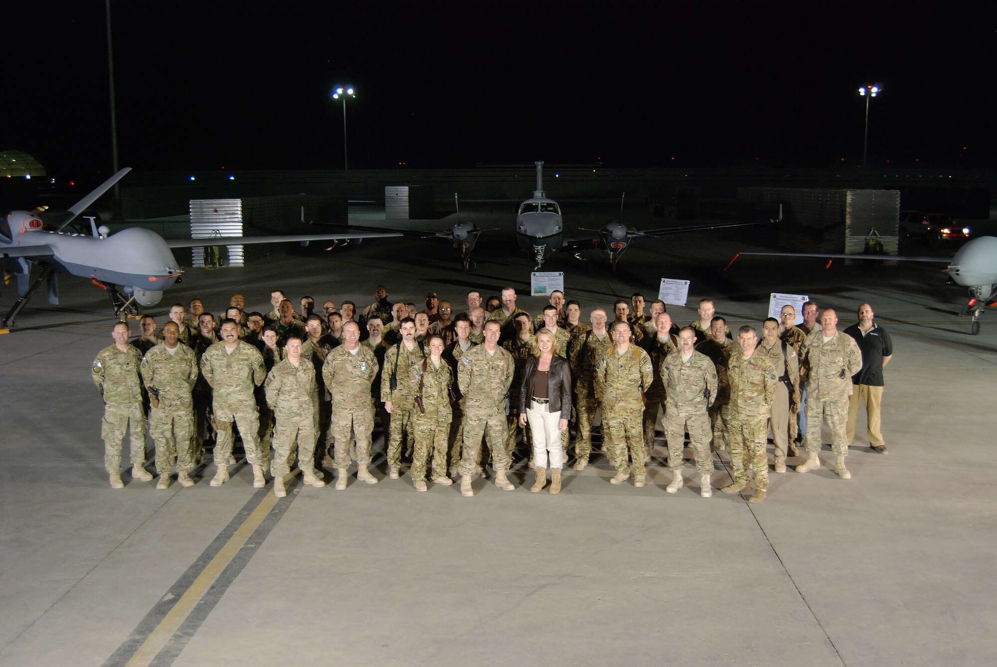 Secretary of the Air Force Deborah Lee James poses with Airmen from the 451st Air Expeditionary Group, March 20, 2014 at Kandahar Airfield, Afghanistan. James spent the day visiting with various units around Kandahar as part of her tour to multiple stops in Afghanistan. (U.S. Air Force photo by Capt. Brian Wagner/Released)