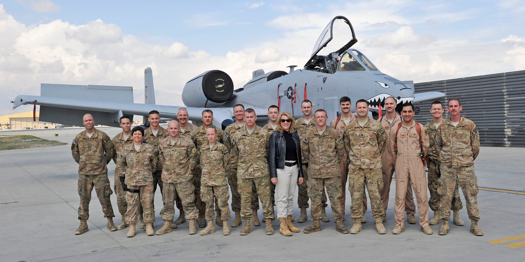 Secretary of the Air Force Deborah Lee James poses with Airmen responsible for maintaining and flying the A-10 Thunderbolt II at Bagram Airfield, Afghanistan, March 22, 2014. James received a tour of the aircraft during her first visit to Afghanistan. (U.S. Air Force photo by Senior Master Sgt. Gary J. Rihn/Released)