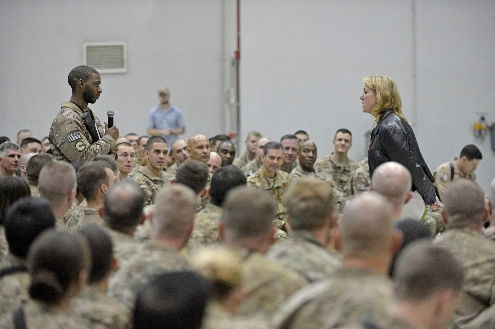 U.S. Air Force Senior Airman Jeremie Bumpers asks a question of Secretary of the Air Force Deborah Lee James during an Airman’s call at Bagram Airfield, Afghanistan, March 22, 2014. James was touring Bagram during her first visit to Afghanistan. (U.S. Air Force photo by Senior Master Sgt. Gary J. Rihn/Released)