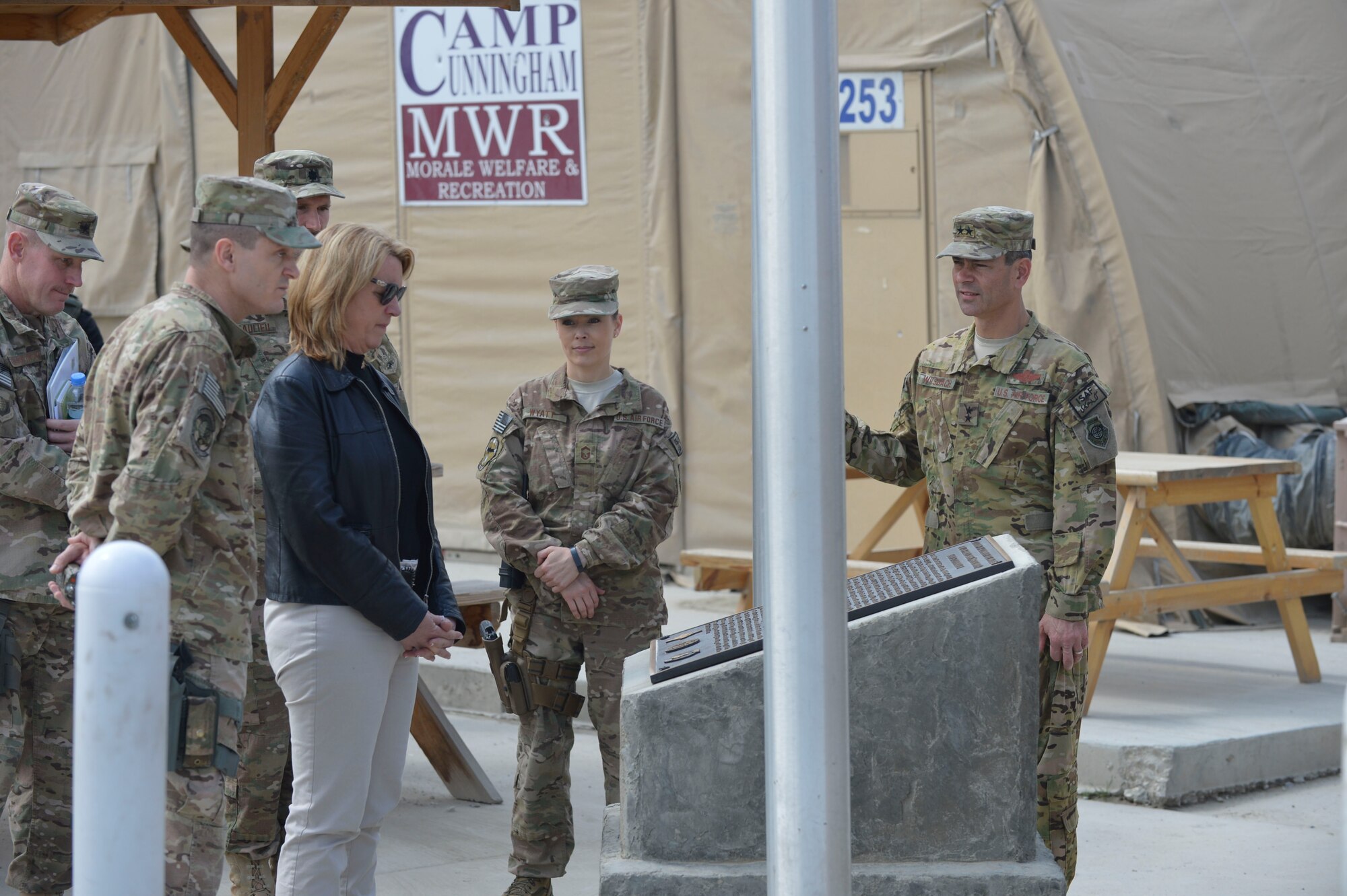 Secretary of the Air Force Deborah Lee James reads the plaque memorializing Senior Airman Jason Cunningham, a pararescueman killed in action during Operation Enduring Freedom, and for whom Camp Cunningham is now named at Bagram Airfield, Afghanistan, March 22, 2014. James was touring Bagram as part of her first visit to Afghanistan. (U.S. Air Force photo by Senior Master Sgt. Gary J. Rihn/Released)