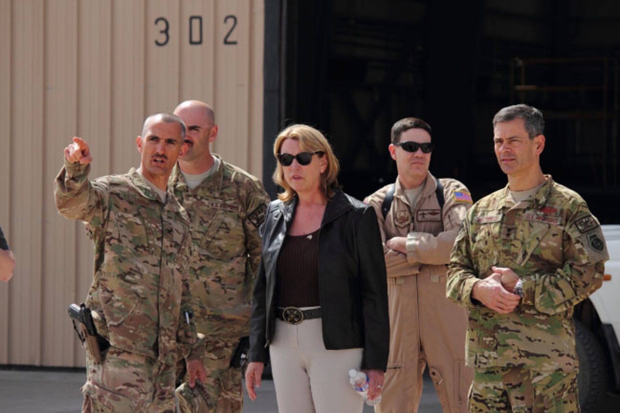 U.S. Air Force Col. Daniel Lasica shows Secretary of the Air Force Deborah Lee James the Afghan parking apron at Shindand Airfield, Afghanistan, where prospective Afghan pilots and aircraft maintainers control and train on more than 20 aircraft ranging from Cessna 172s, Cessna 208s, and a C-130 Hercules, March 19, 2014. James toured the training flightline during her first official Afghanistan tour.(U.S. Air Force photo by Senior Airman Joshua Drake/Released)