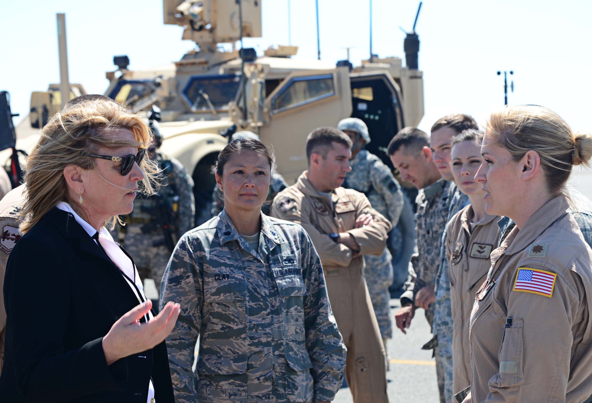 Maj. Sheila Carlson, 737th Expeditionary Airlift Squadron assistant director of operations, discusses C-130J mission capabilities with Secretary of the Air Force Deborah Lee James at an undisclosed location in Southwest Asia. During James' first visit to Air Forces Central Command’s area of responsibility as Secretary, she spoke with Airmen and gained a better understanding of the AOR and its missions. Carlson is deployed from the 146th Airlift Wing, Channel Islands Air National Guard Station, Calif. (U.S. Air Force photo by Senior Airman Desiree W. Moye)