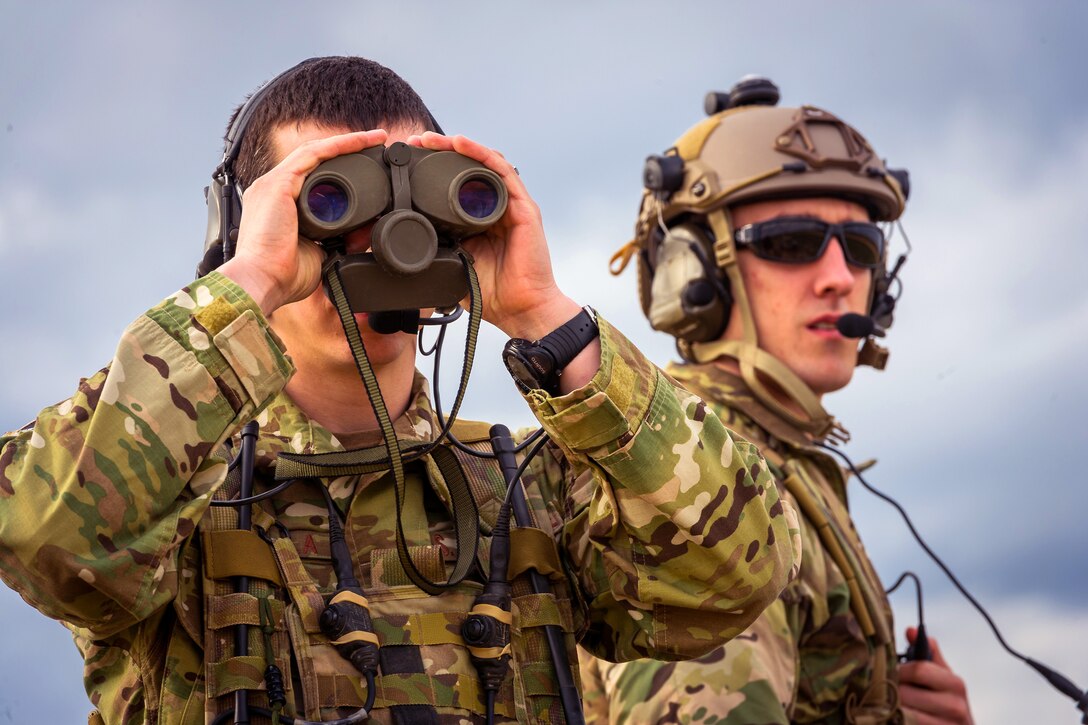 Air Force Senior Airmen's Brian Huhtala, left, and Colt Gass monitor ...