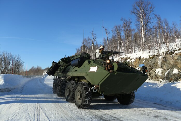 Along a coastal mountain road, a light-armored reconnaissance vehicle, the LAV-25, patrols through a small Norwegian village during Cold Response 14. Cold Response 14 brought together nearly 16,000 troops from 16 countries to train high-intensity operations in the unique climate above the Arctic Circle and strengthen the alliance of partners and their commitment to global security in every clime and place.
