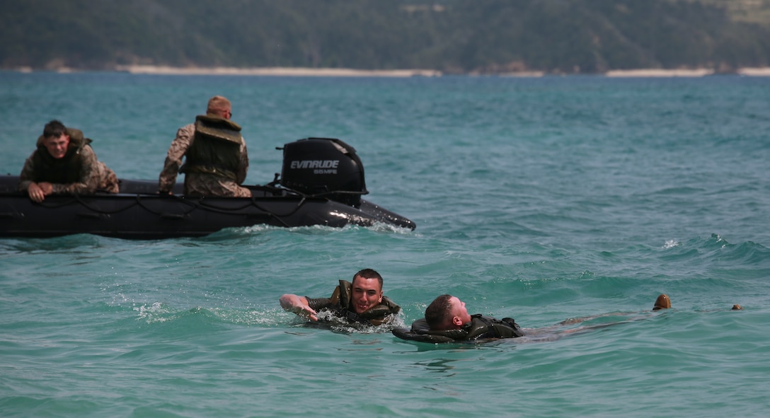 Marines execute man-overboard drills, March 19, during water-mobility training in the ocean off the Camp Schwab Beach. In each Combat Rubber Raiding Craft, a Marine was designated a safety swimmer to rescue simulated victims. The Marines are combat engineers with Company A, 9th Engineer Support Battalion, 3rd Marine Logistics Group, III Marine Expeditionary Force.