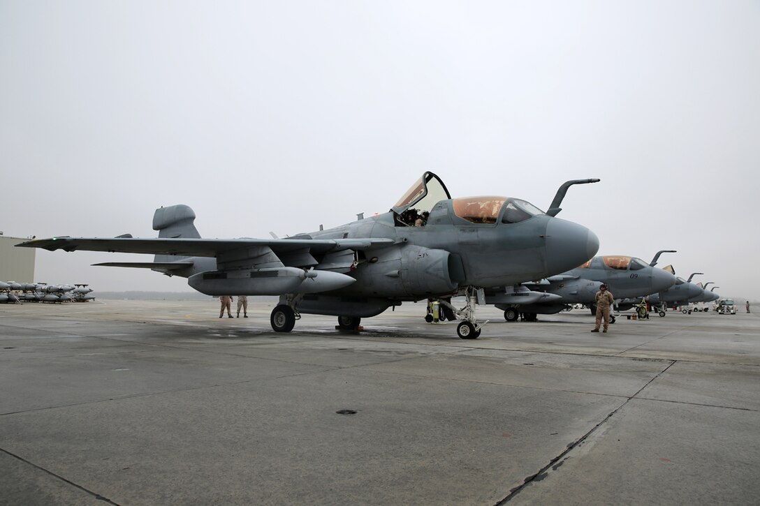 Pilots and crew with Marine Tactical Electronic Warfare Squadron 4 prepare their EA-6B Prowlers for a mission at Marine Corps Air Station Cherry Point, N.C. March 19, 2014. During the mission, the pilots conducted a division lead qualification for training pilots en route to MCAS Yuma, Ariz. VMAQ-4’s mission is to support the Marine Air Ground Task Force by conducting airborne electronic warfare.   