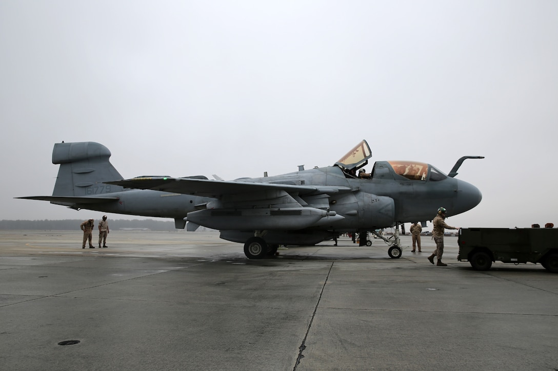 Pilots and crew with Marine Tactical Electronic Warfare Squadron 4 prepare their EA-6B Prowlers for a mission at Marine Corps Air Station Cherry Point, N.C. March 19, 2014. During the mission, the pilots conducted a division lead qualification for training pilots en route to MCAS Yuma, Ariz. VMAQ-4’s mission is to support the Marine Air Ground Task Force by conducting airborne electronic warfare.  