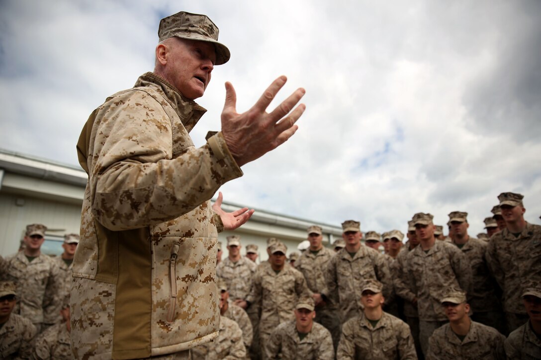 Lieutenant Gen. Richard Tryon, commander of U.S. Marines Forces Command and U.S. Marine Corps Forces, Europe, talks with Marines of 3rd Battalion, 8th Marine Regiment, 2nd Marine Division assigned to Black Sea Rotational Force 14, aboard Mihail Kogalniceanu Air Base, Romania, March 17, 2014. Tryon visited the base to speak to the Marines on BSRF-14 and to tour the installation. Black Sea Rotational Force 14 is a contingent of Marines and sailors tasked with maintaining positive relations with partner nations, regional stability and increasing interoperability while providing the capability for rapid crisis response, as directed by U.S. European Command, in the Black Sea, Balkan and Caucasus regions of Eastern Europe. (Official Marine Corps photo by Lance Cpl. Scott W. Whiting, BSRF PAO/ Released)