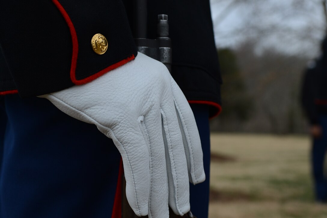 Cpl. Lloyd Boyde, a rifle bearer with Marine Corps Base Quantico's Ceremonial Platoon, clutches his rifle at the position of attention before executing right shoulder-arms at the James Madison wreath laying ceremony at Montpellier Station March 16, 2014. Each year across the country Marines participate in laying wreaths on former president's gravesites in honor of the position they've held.