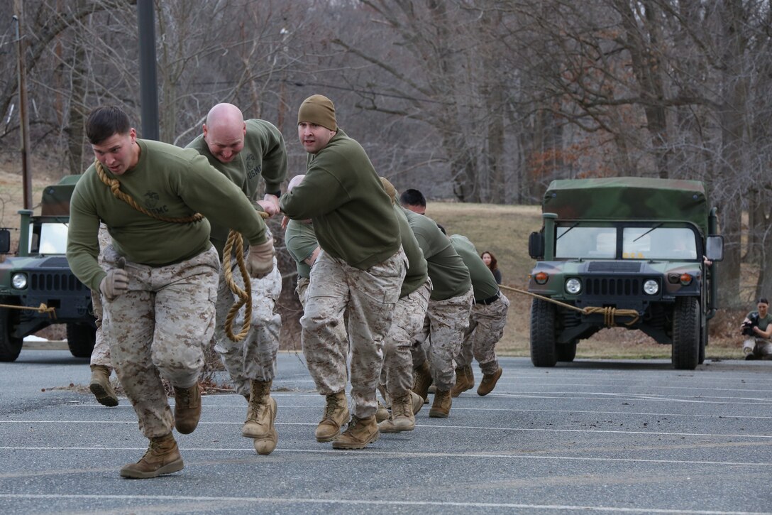 Marines pull a Humvee in one of the events for the first-ever Marine Corps Base Quantico Field Meet held at Butler Stadium on March 21, 2014. The Marines competed in relays, games and a tug-of-war to see who would win the trophy.