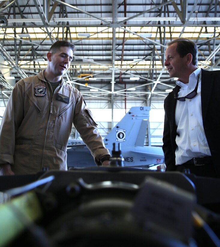 Captain Jack Holloway, a pilot with Marine All-Weather Fighter Attack Squadron 533, explains aviation equipment and their uses during a tour of VMFA(AW)-533 by members of the Medal of Honor Society, March 14.
