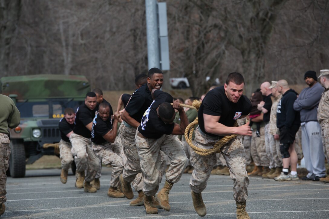 The Marines of Marine Corps Embassy Security Group pull a Humvee during the basewide field meet held on March 21, 2014, at Butler Stadium. More than 15 teams competed in several events like relays, games and tug-of-war.