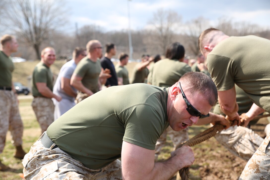 A Marine pulls a rope during the tug-of-war section of the Marine Corps Base Quantico basewide field meet on March 21, 2014, at Butler Stadium. The Marines competed in relays, games and a tug-of-war.
