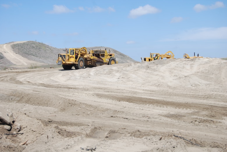 The scrapers deposit some of the nearly 90,000 cubic yards of beach quality sand in a separate area that Oceanside will ultimately use to replenish a segment of its shoreline.