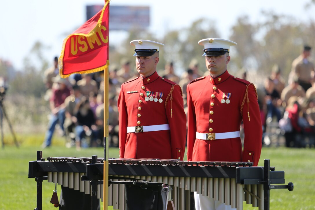 Marines with the Battle Color Detachment stand at attention after a song during a performance aboard Marine Corps Air Station Miramar, Calif., March 14.