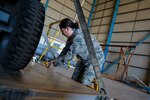Maj. Camille LaDrew, a logistics officer from the Texas Air National Guard, ties down F-16 engine equipment and tools in Santiago, Chile, March 24, 2014. She is one of nearly 60 U.S. Airmen participating in subject matter expert exchanges with Chilean air force counterparts, and involved in hosting static displays of the C-130 Hercules and F-16 Fighting Falcon during the FIDAE Air Show in Santiago, March 25 through 30. The exchanges, conducted regularly throughout the year, involve U.S. Airmen sharing best practices and procedures to build partnerships and promote interoperability with partner-nations throughout South America, Central America and the Caribbean.
