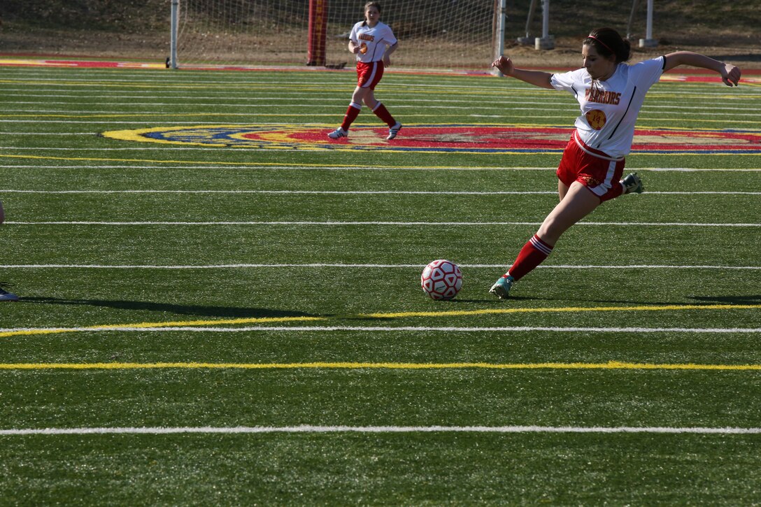 Raquel, a sophomore for the Quantico Middle/High School girls soccer team, prepares to kick the ball towards the goal in a game against Grace Preparatory School from Stafford, in a game at Butler Stadium on March 20, 2014. Quantico won the game, 8-0.