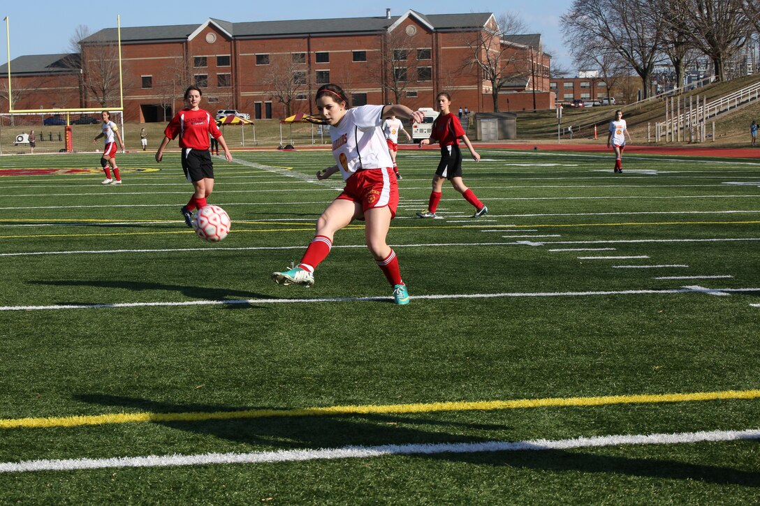 Raquel, a sophomore for the Quantico Middle/High School girls soccer team, kicks the ball towards the goal in a game against Grace Preparatory School from Stafford, in a game at Butler Stadium on March 20, 2014. Quantico dominated Grace with a final score of 8-0.