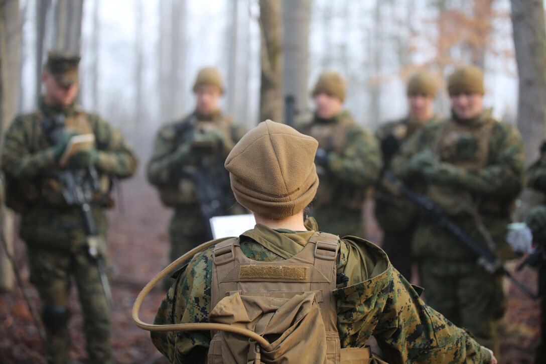 1st Lt. Melissa Cooling, squad leader, briefs her squad before beginning a field exercise at Range 5 aboard Marine Corps Base Quantico on March 21, 2014. The Basic School Marines will conduct four field exercises before graduating the six-month course