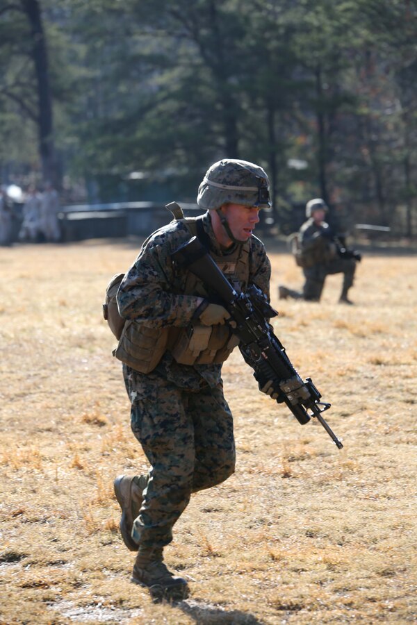1st Lt. Bill Lining, fire team leader, practices squad movements during a field exercise at Range 5 aboard Marine Corps Base Quantico on March 21, 2014. More than 100 Marines participated in the exercise. 