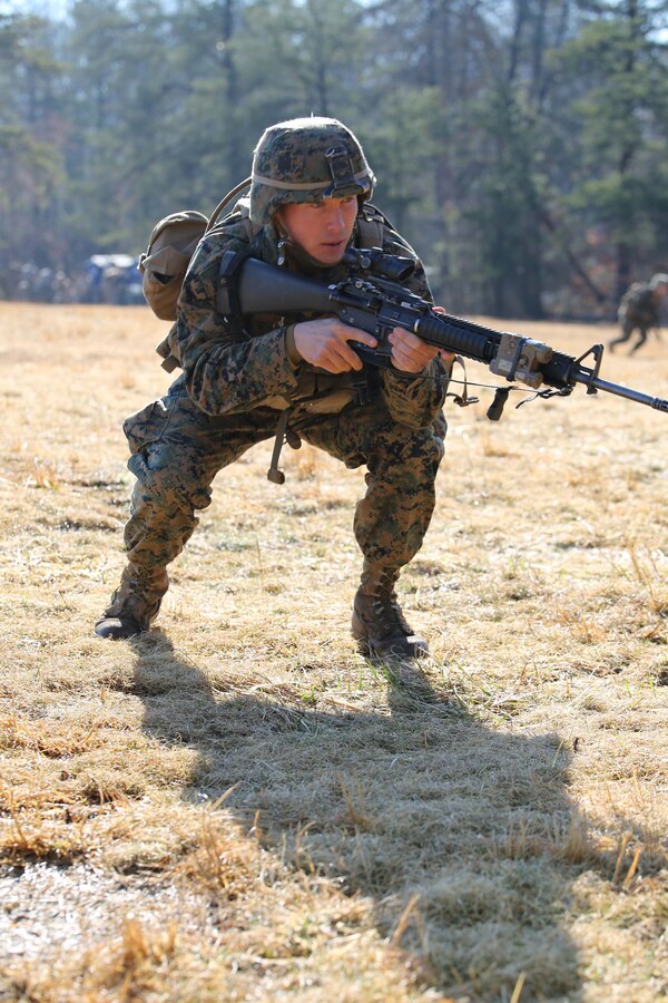 1st Lt. Bill Lining, fire team leader,  practices squad movements during a field exercise at Range 5 aboard Marine Corps Base Quantico on March 21, 2014. The Basic School Marines will conduct four field exercises before graduating the six-month course. 