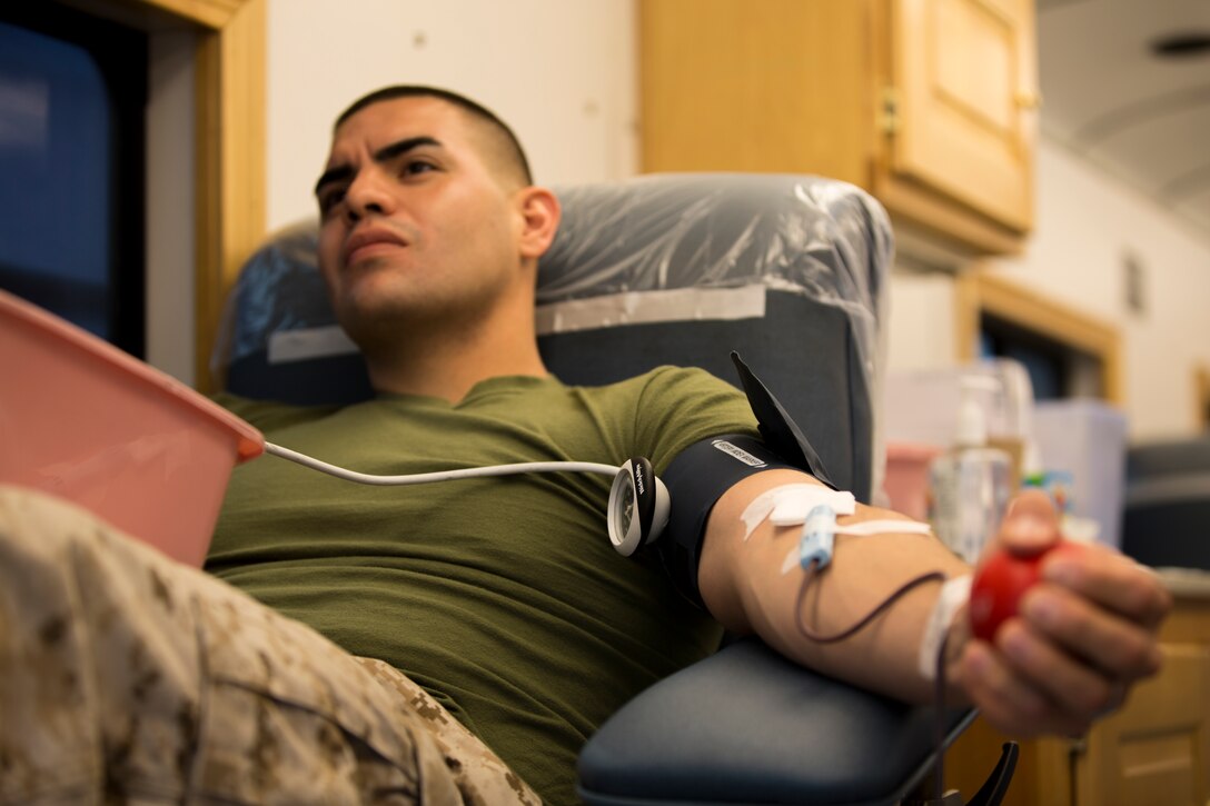 Lance Cpl. Jeremy Sanabria, data technician with station data communications, donates blood during a blood drive aboard Marine Corps Air Station Miramar, Calif., March 25. Marines and Sailors participated in the blood drive, hosted by the Naval Medical Center San Diego, outside the air station’s Marine Corps Exchange. 