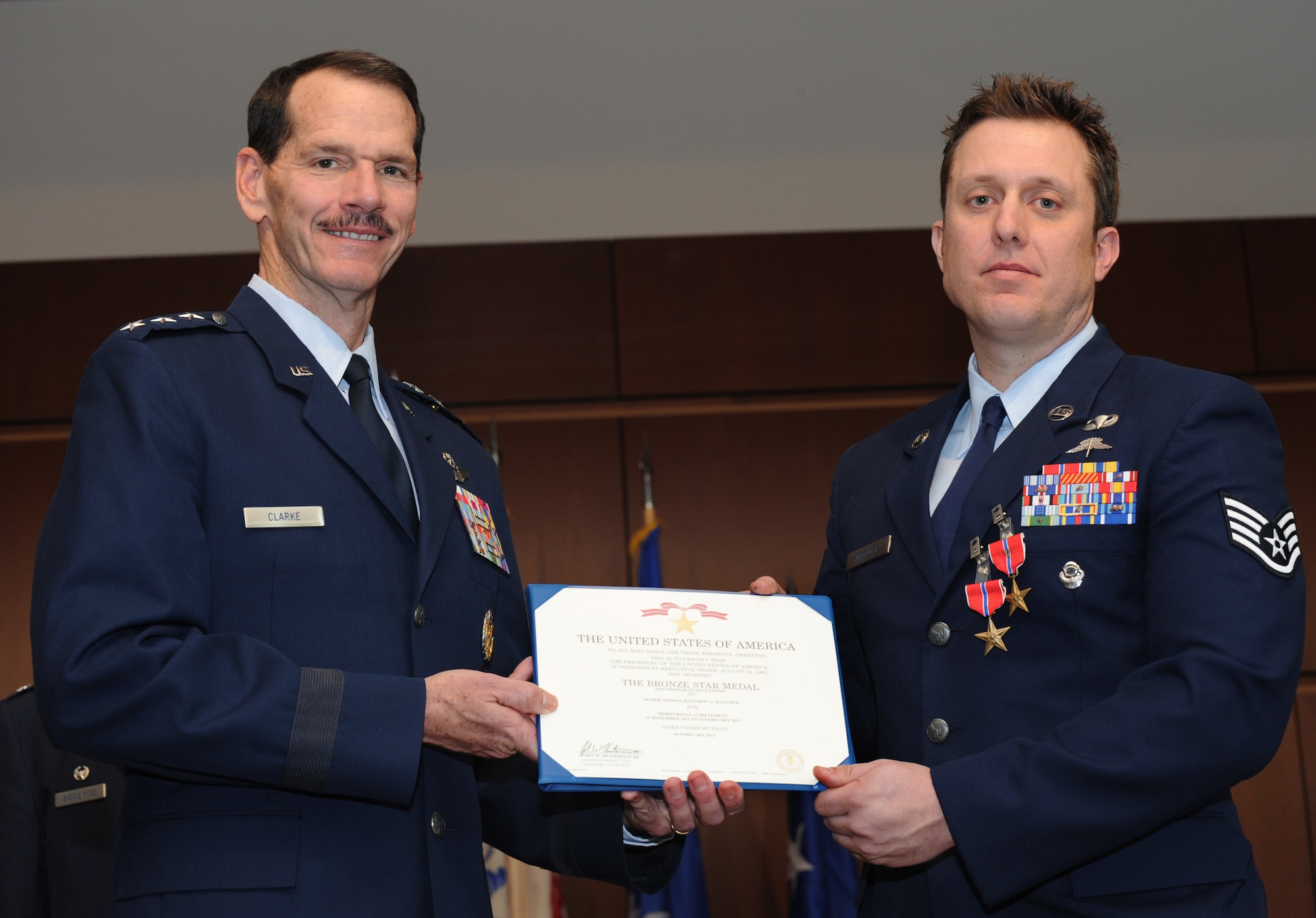 Air National Guard Director Lt. Gen. Stanley E. Clark III, presents the Bronze Star medal to Staff Sgt. Matthew Matlock, a combat controller with the Oregon Air National Guard's 125th Special Tactics Squadron, during a ceremony at the 41st Infantry Division Armed Forces Reserve Center at Camp Withycombe, in Clackamas, Ore., March 24, 2014. (U.S. Air National Guard photo by Tech. Sgt. John Hughel, 142nd Fighter Wing Public Affairs/Released)