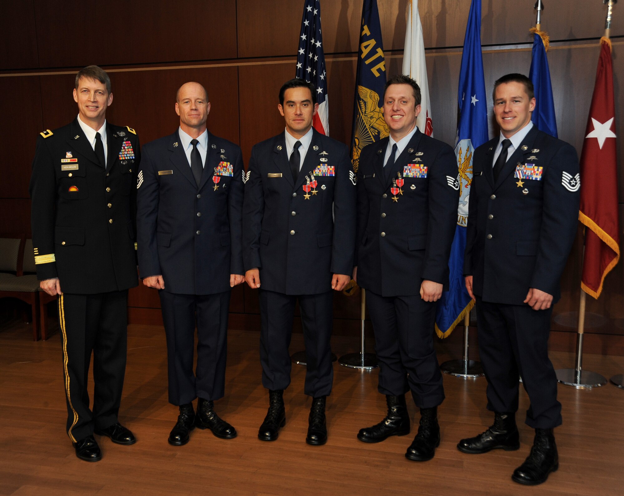 Combat controllers with the Oregon Air National Guard's 125th Special Tactics Squadron stand in for a group photo with Maj. Gen. Daniel R. Hokanson, (left), Adjutant General, Oregon, following an award ceremony, March 24, at the 41st Infantry Division Armed Forces Reserve Center at Camp Withycombe, in Clackamas, Ore. From left: Maj. Gen. Daniel Hokanson; Tech. Sgt. George Thompson received the Bronze Star; Staff Sgt. Christopher Jones received the Bronze Star with Valor and first Oak Leaf Cluster; Staff Sgt. Matthew Matlock received the Bronze Star Medal with Valor and second Oak Leaf Cluster; and Tech. Sgt. Doug Matthews received the rarely awarded Silver Star; and. (U.S. Air National Guard photo by Tech. Sgt. John Hughel, 142nd Fighter Wing Public Affairs/Released) 