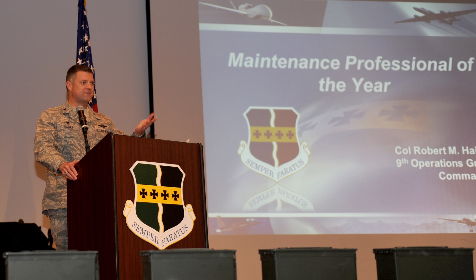 Col. Robert Haines, 9th Operations Group commander, speaks during the Maintenance Professional of the Year banquet at the Community Activity Center, Mach 21, 2014. Haines was the guest speaker at the event.  (U.S. Air Force photo by Staff Sgt. Robert M. Trujillo/Released)