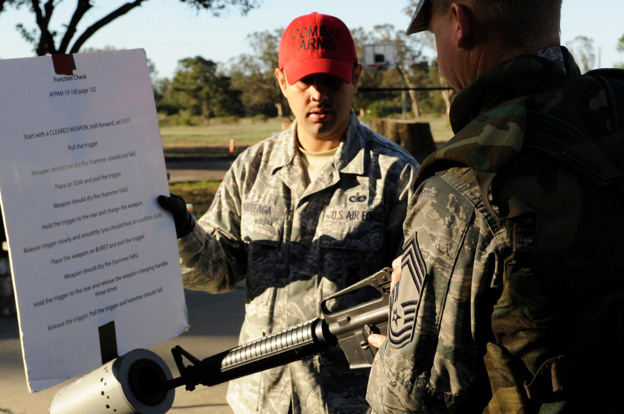 Chief Master Sgt. David Ovesen, 30th Operations Group superintendent, clears his weapon during a mass deployment scenario, March 19, 2014, Vandenberg Air Force Base, Calif. In an effort to measure aptitudes and deficiencies, Airmen throughout VAFB recently participated in a Deployment/Emergency Management Exercise. (U.S. Air Force photo/ Senior Airman Shane Phipps)