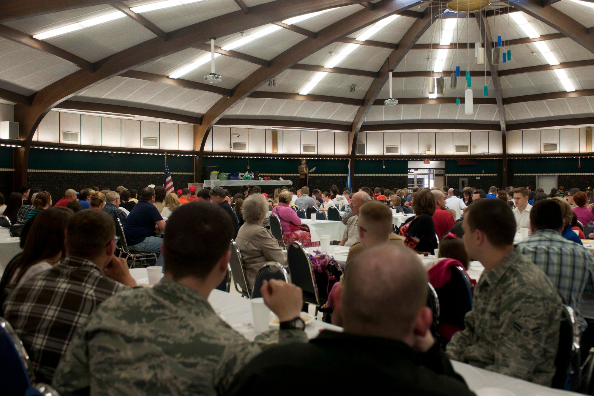 ALTUS, Okla. – New members of Altus Air Force Base, returning deployers and their families attend the Committee of 100 dinner held at the Altus High School Cafetorium March 24, 2014. The Altus Chamber of Commerce Committee of 100 welcomes Altus AFB newcomers, students, and those returning from deployment during a meet and greet dinner held quarterly. (U.S. Air Force Photo by Senior Airman Jesse Lopez/Released) 