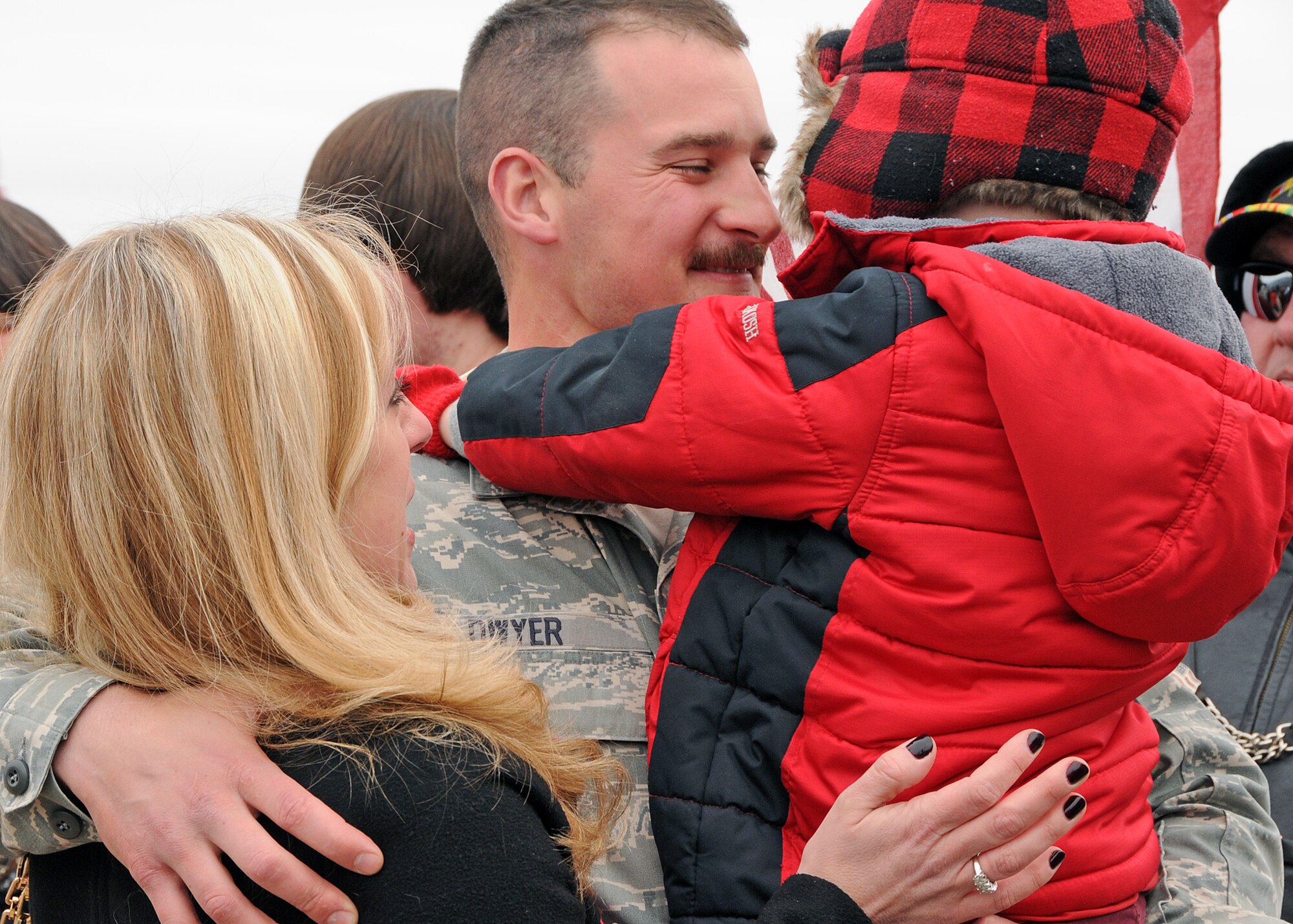 Familiy and friends rush to greet their loved ones upon their return. The Airmen are members of the 143d Airlift Wing returning from a deployment to Kuwait in support of Operation Enduring Freedom. National Guard Photo by Master Sgt Janeen Miller (RELEASED)