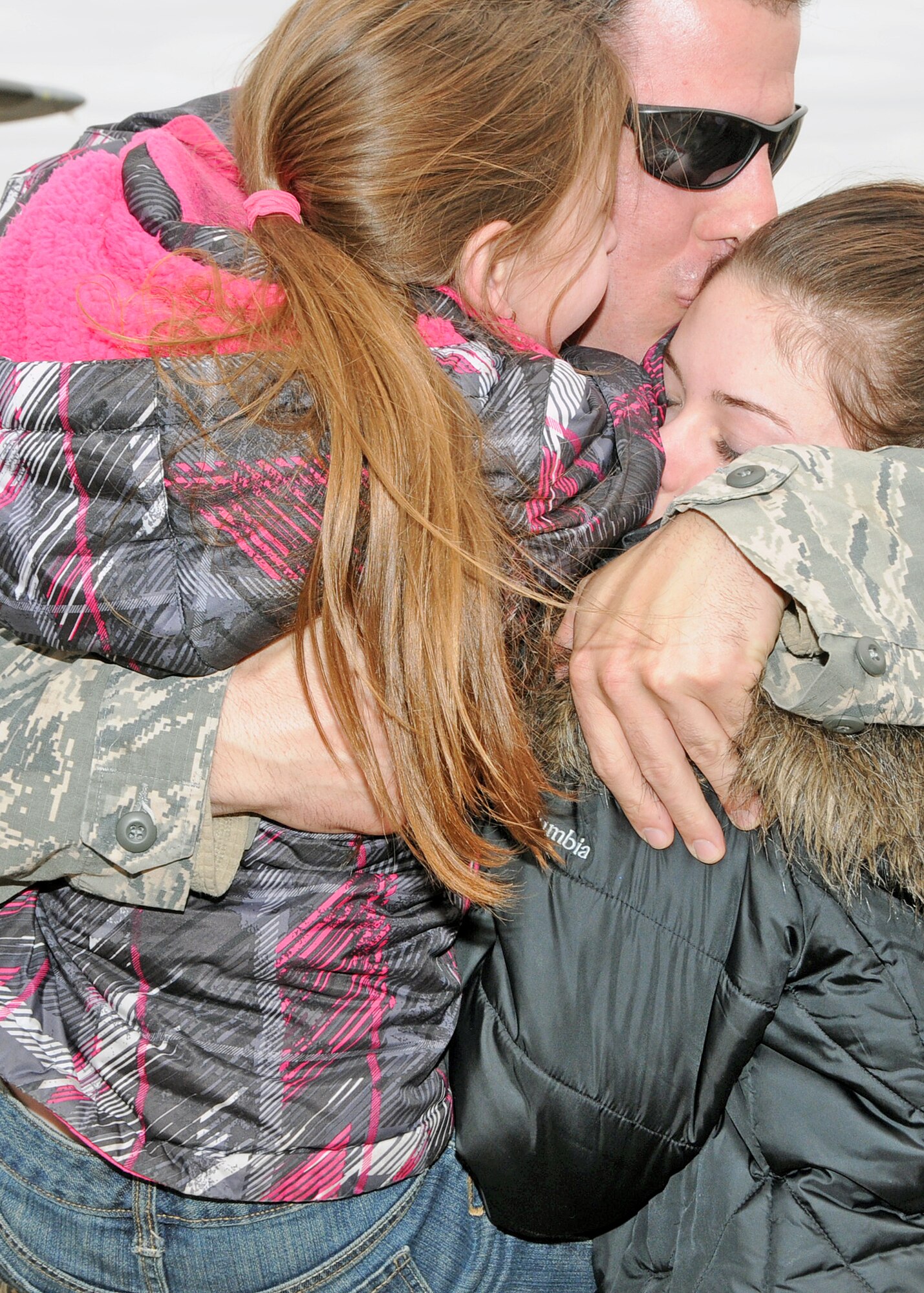 Familiy and friends rush to greet their loved ones upon their return. The Airmen are members of the 143d Airlift Wing returning from a deployment to Kuwait in support of Operation Enduring Freedom. National Guard Photo by Master Sgt Janeen Miller (RELEASED)
