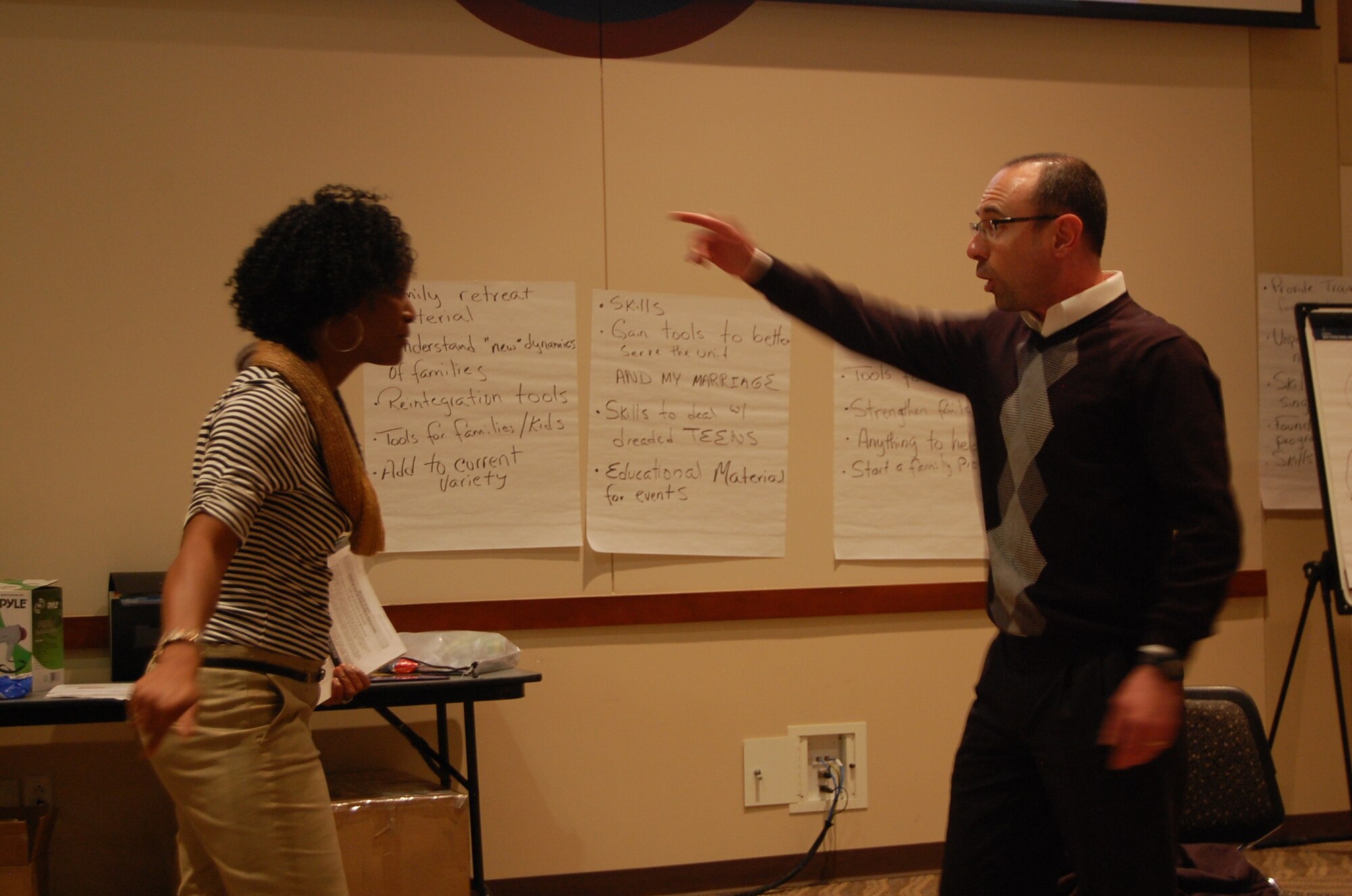 Tech. Sgt. Lisa Bobo, chaplain assistant (left), and Capt. Charles Ferry, chaplain (right), perform a skit demonstrating the destructive behavior of making excuses. Chaplains and support personnel from around the nation gathered March 17-21, 2014 to teach and learn from each other at Buckley Air Force Base, Aurora, Colo. (U.S. Air National Guard photo by 1st. Lt. Ben Garland)