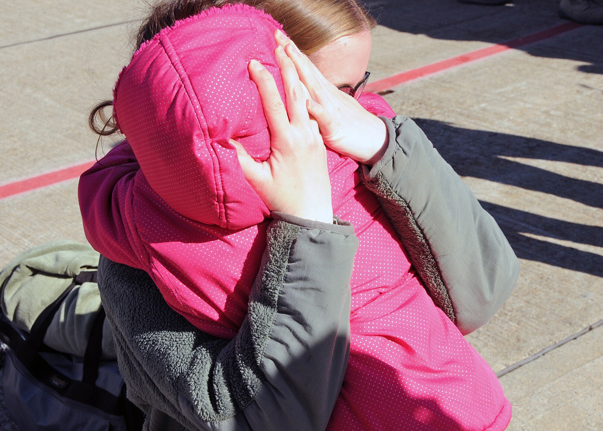 Familiy and friends rush to greet their loved ones upon their return. The Airmen are members of the 143d Airlift Wing returning from a deployment to Kuwait in support of Operation Enduring Freedom.. National Guard Photo by Master Sgt Janeen Miller (RELEASED)