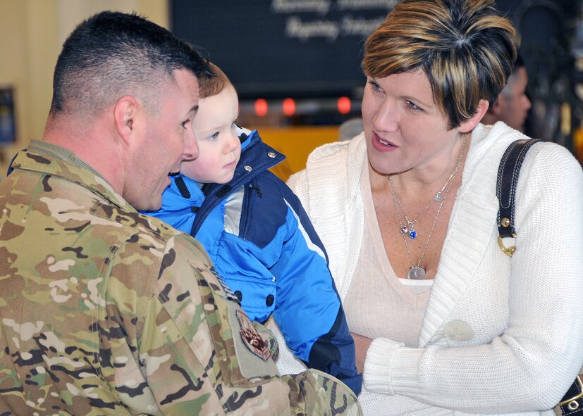 Familiy and friends rush to greet their loved ones upon their return. The Airmen are members of the 143d Airlift Wing returning from a deployment to Kuwait in support of Operation Enduring Freedom.. National Guard Photo by Master Sgt Janeen Miller (RELEASED)