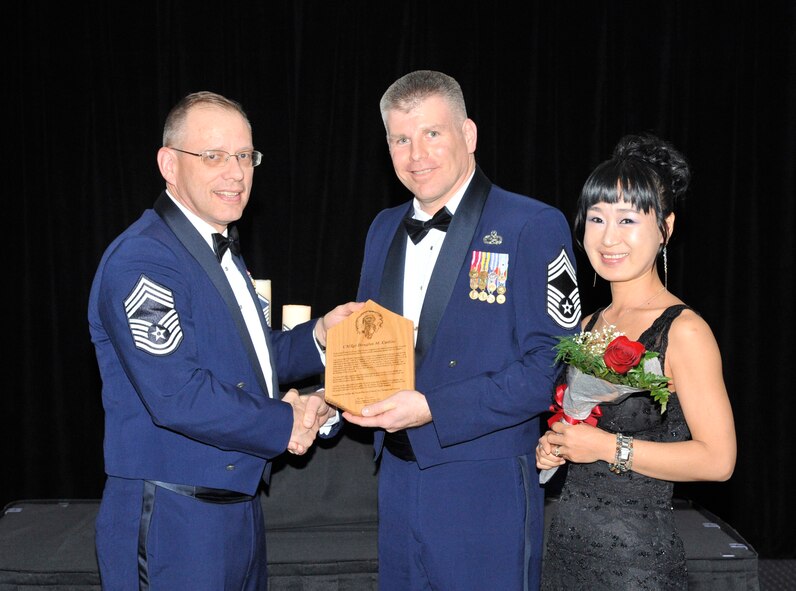 U.S. Air Force Chief Master Sgt. Douglas Collins, 509th Munitions Squadron superintendent, receives a Chief’s creed plaque at Whiteman Air Force Base, Mo., March 21, 2014. It is tradition for Chiefs to receive the plagues as an introduction to their new position. (U.S. Air Force photo by Airman 1st Class Keenan Berry/Released)