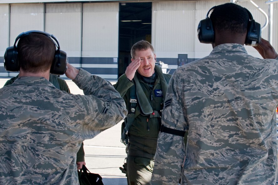 Col. Lamar Pettus, 4th Fighter Wing vice commander, salutes Airmen from the 4th Maintenance Squadron on the flightline prior to participating in RAZOR TALON, March 21, 2014, at Seymour Johnson Air Force Base, N.C. 4th Fighter Wing Airmen trained on emergency response and recovery procedures during the exercise. (U.S. Air Force photo/Airman 1st Class Aaron J. Jenne)