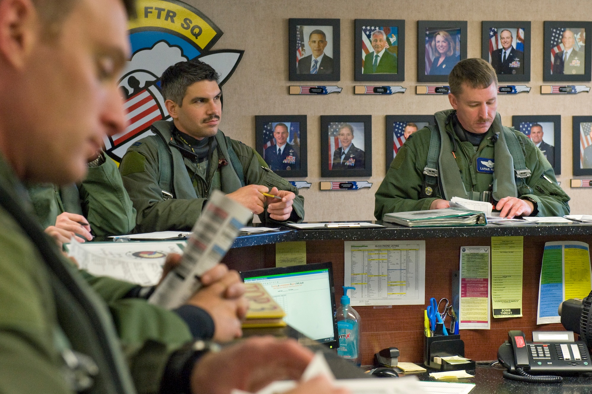 Col. Lamar Pettus (far right), 4th Fighter Wing vice commander, attends a pre-flight briefing with pilots from the 336th Fighter Squadron, March 21, 2014, at Seymour Johnson Air Force Base, N.C. Pettus participated in RAZOR TALON, a monthly large-force exercise intended to hone air-sea combat skills, for the first time. (U.S. Air Force photo/Airman 1st Class Aaron J. Jenne)