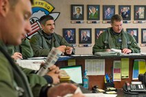 Col. Lamar Pettus (far right), 4th Fighter Wing vice commander, attends a pre-flight briefing with pilots from the 336th Fighter Squadron, March 21, 2014, at Seymour Johnson Air Force Base, N.C. Pettus participated in RAZOR TALON, a monthly large-force exercise intended to hone air-sea combat skills, for the first time. (U.S. Air Force photo/Airman 1st Class Aaron J. Jenne)