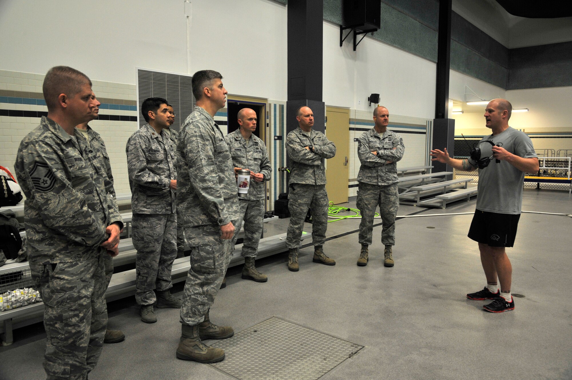 Master Sgt. James Goyet, 66th Training Squadron water survival flight chief, briefs 92nd Mission Support Group commander, Col. Konrad Klausner, and other MSG leadership about the water survival training course at Fairchild Air Force Base, Wash., March 21, 2014. During the immersion with the Survival, Evasion, Resistance and Escape team, MSG members got to witness their mission firsthand while touring facilities and meeting with SERE Airmen. (U.S. Air Force photo by Senior Airman Mary O'Dell/Released)