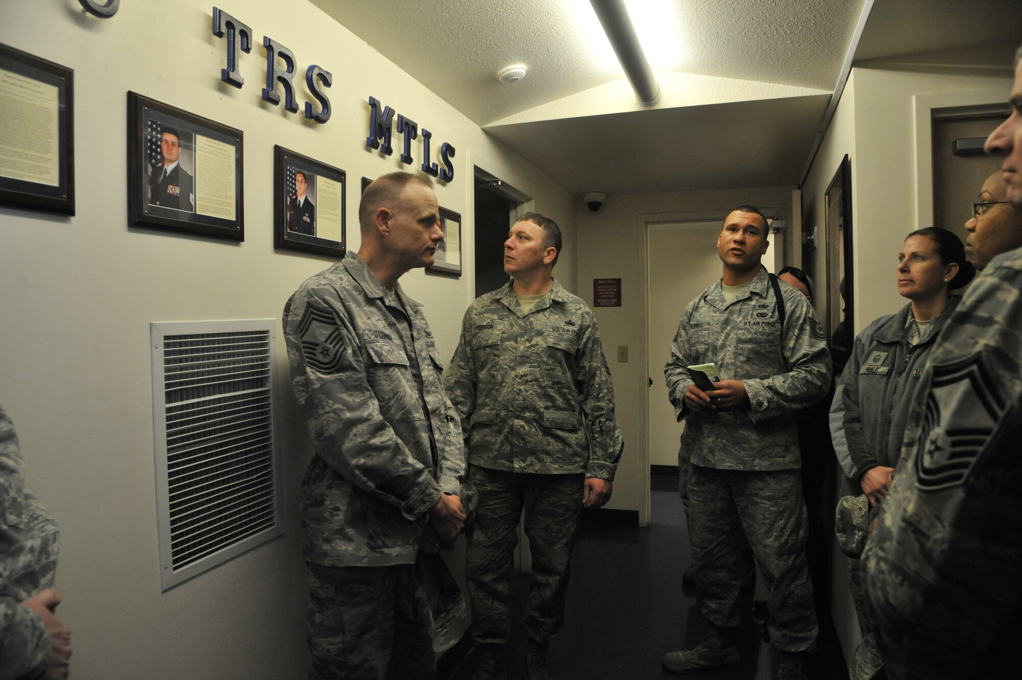 Tech. Sgt. Titus Serrel, 66th Training Squadron military training leader, introduces the other MTLs to 92nd Mission Support Group members at a dormitory facility at Fairchild Air Force Base, Wash., March 20, 2014. MSG squadron commanders, first sergeants and superintendents toured the Survival, Evasion, Resistance and Escape facilities during an immersion to help them better understand the SERE mission. (U.S. Air Force photo by Senior Airman Mary O'Dell/Released)