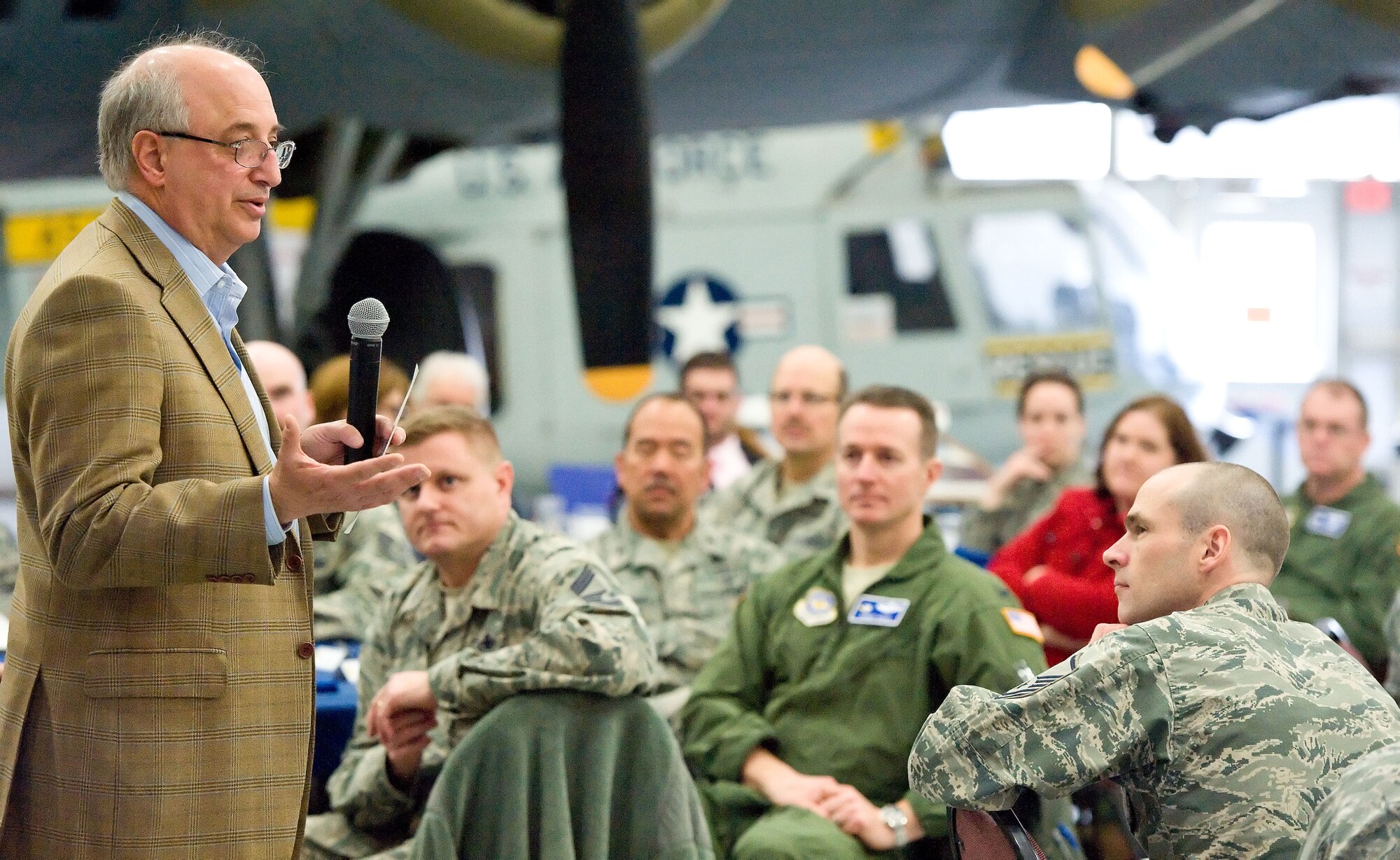 Ralph Galati, a former prisoner of war, speaks to Team Dover members during a luncheon March 19, 2014, at the Air Mobility Command Museum on Dover Air Force Base, Del. Galati toured numerous facilities around the base and delivered an inspiring speech to Team Dover luncheon attendees. (U.S. Air Force photo/Roland Balik)