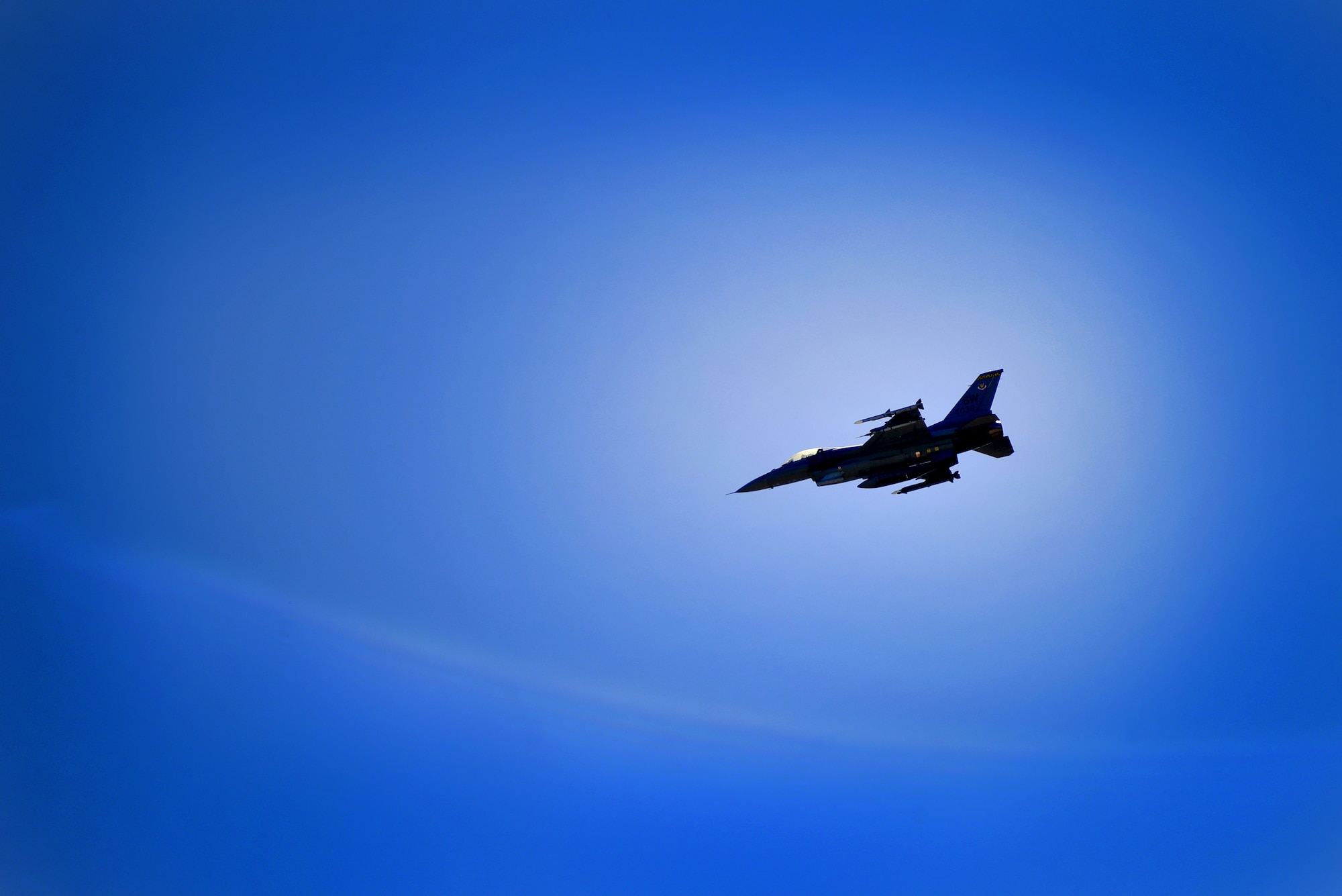 A U.S. Air Force F-16CJ Fighting Falcon flies over Shaw Air Force Base during a routine sortie, March 21, 2014, Shaw Air Force Base, S.C. During takeoff and landing, fighter pilots rely on an Aircraft Arresting System which is designed to stop aircraft during emergency situations like break failure. Airmen assigned to the 20th Civil Engineer Squadron recently worked with a 55th Fighter Squadron pilot to test the AAS for accuracy and proper function. (U.S. Air Force photo by Staff Sgt. Kenny Holston/Released)